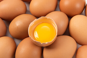 eggs and egg yolk on the yellow background.