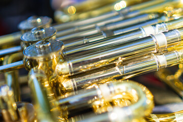Fototapeta premium photo detail of a golden french horn, shining from new