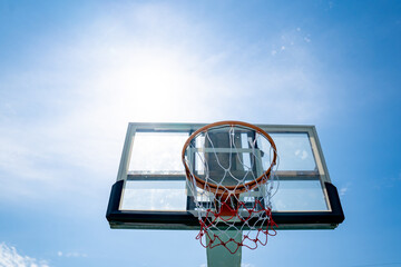Net and board of basketball sport on blue sky background, sunny on daytime of sky, sport for exercise to good health