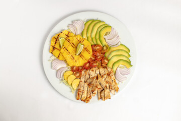 Grilled chiken breast fillet with veggies and pineapple