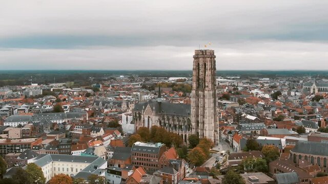 St. Rumbold's Cathedral (Sint Romboutskathedraal), Mechelen, Belgium. Aerial scenic cityscape. Orbiting shot