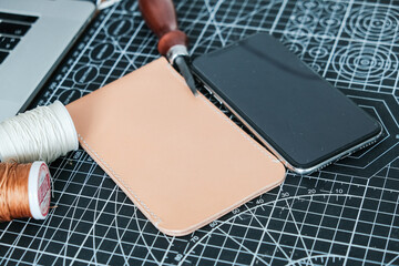 Vegetable tanned leather phone case craftmaship working with thread and tool