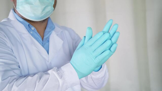 4K slow motion of conceptual Doctor in scrubs. mask and gloves. celebrating success with applause. Applause to encourage doctors and nurses to fight COVID-19