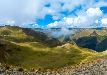 natural landscape in the Andes of Peru watching a sky with clouds and small lakes formed by rain watching on a cold morning breathing fresh air
