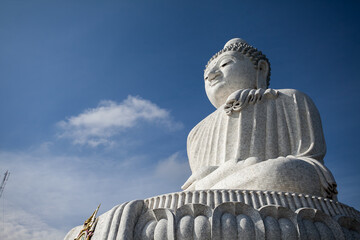Statue of Big Buddha with a blue sky background in Phuket, Thailand.