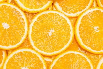 Orange background. Slices of oranges.
