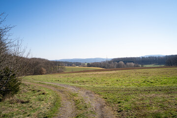 Countryroad in the landscape with blue sky
