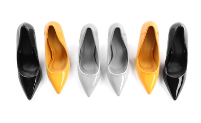 Different high heels on white background