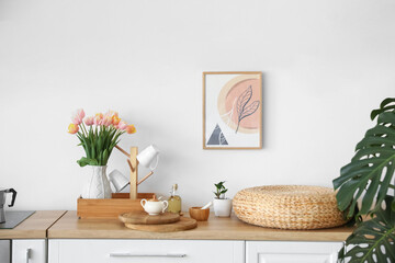 Bouquet of beautiful tulip flowers on counter in kitchen