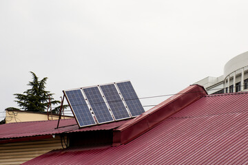Solar panels on the roof of the house on building roof