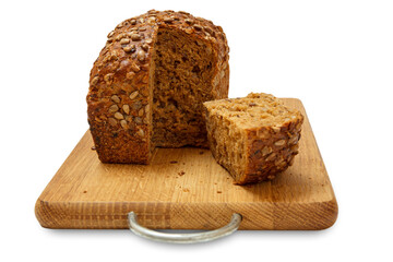 Cut loaf of bread on wooden cutting board on white background