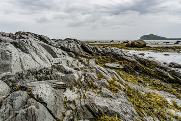 Close up of the rugged and rocky shore in Parc National du Bic near Rimouski in Bas St Laurent (Quebec, Canada) on a rainy and moody day