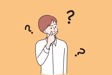 Feeling doubt, question, making decision concept. Young frustrated man or boy cartoon character standing feeling doubt with question signs above vector illustration 