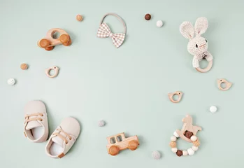 Fototapeten Baby shoes and teethers. Organic newborn accessories, branding, small business idea © netrun78