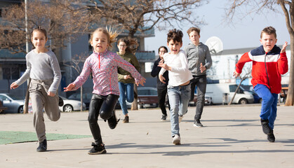 Activity children compete in the city street. High quality photo