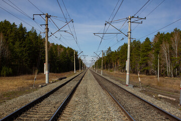 Fototapeta na wymiar Double track railway. Direct section of the electrified double-track railway.