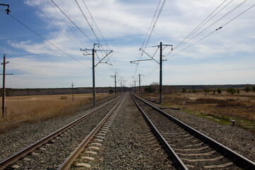 Fototapeta na wymiar Double track railway. Direct section of the electrified double-track railway.