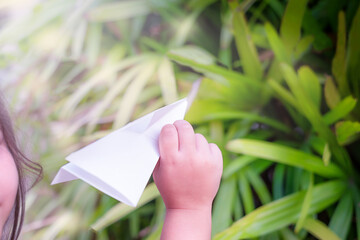 The child play with paper plane