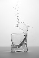 Glass with water with splash