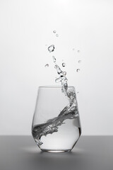 Glass with water with splash