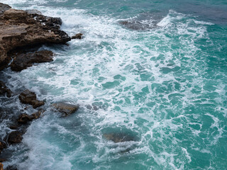 view of ocean waves and a fantastic rocky shore