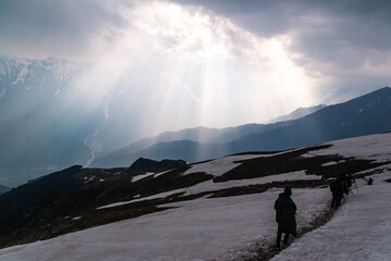 Hikers make their way up a hill on the Bhrigu Lake trek in northern India