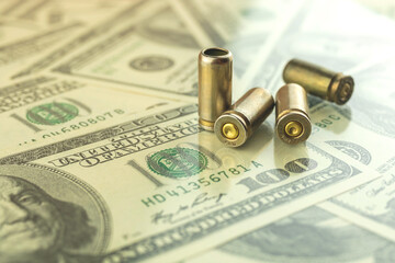 Bullet on the dollar background, criminal money and corruption, illegal trading concept