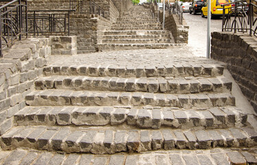 Old stone steps with paving stones.