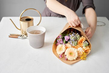 Unpacking Flowers bunch, set for home. Fresh cut flowers for decoration home. European floral shop. Delivery fresh cut flower.