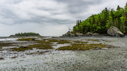 Low tide at Parc National du Bic near Rimouski in Bas St Laurent (Quebec, Canada) on a rainy and moody day