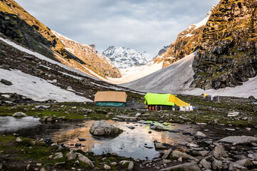 Tents at a campsite at the edge of the Himalayas, on the Hampta Pass trek in northern India