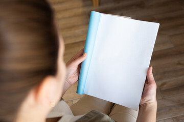 Female hands open blank catalog, magazines, book mock up