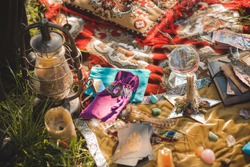 Gypsy soul... Boho woman with Tarot cards, candles and magic ball at field, lifestyle, predicting, ideas for costume on Halloween