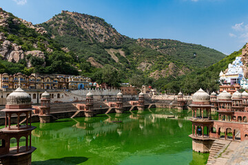 Fototapeta premium Reflection in water of historical buildings commonly known as Chhatris or cenotaphs. This is very pupilar traditional architecture among Rajastan old royal families to respect their loved ones.