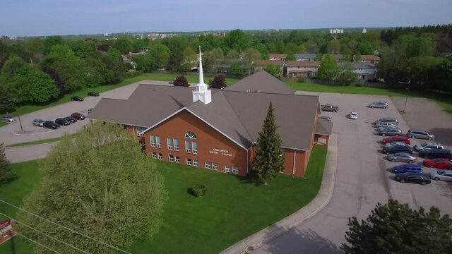 Drone shot of church revealing the neighbourhood in London, Ontario Canada