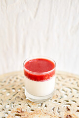 Panakota fresh cream dessert with strawberries on table.