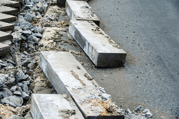 Dismantling of concrete curbs. Improvement and repair of roads on city streets. Close-up