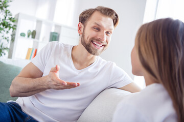 Fototapeta premium Photo of pretty charming daughter father wear casual outfit sitting sofa talking about last news indoors apartment house