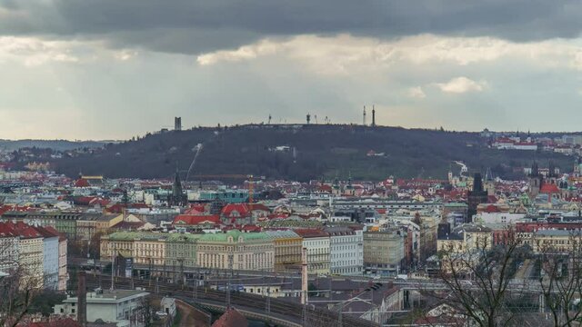 Timelapse of city skyline, pan with fast moving clouds, winter day