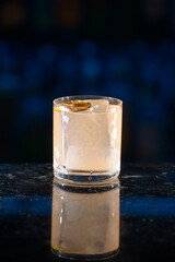 beige refreshing coctail on a bar desk