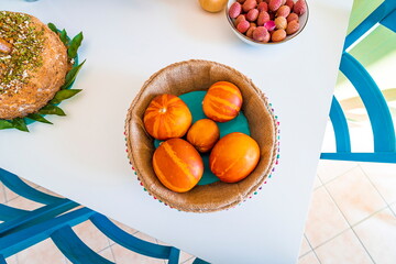 Table top view of fresh orange decorative pumpkins in a bowl 