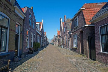 Fototapeta na wymiar Medieval houses in the streets of Hindeloopen in the Netherlands