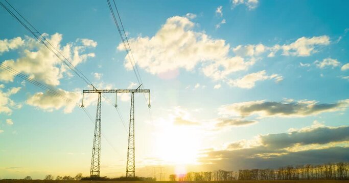 Timelapse of the electric pole with wires against the background of sky at sunset