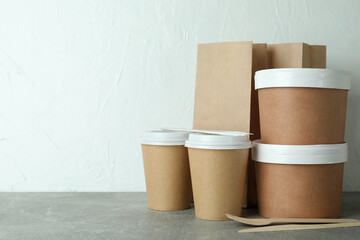 Delivery containers for takeaway food on gray textured table