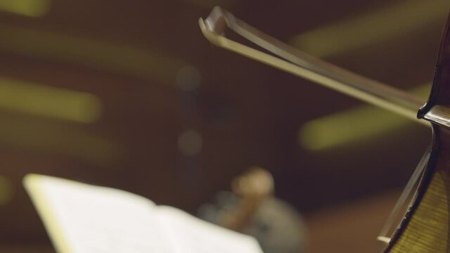 Playing a cello, very close