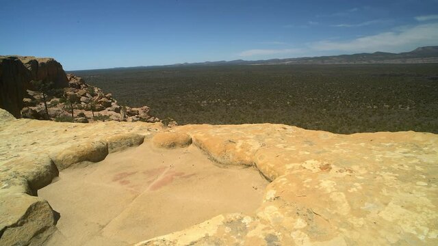 Sandstone Bluffs, El Malpais National Monument in the desert of New Mexico is a dramatic landscape made of Dakota Sandstone that contrasts with the dark lava flows farther below. USA
