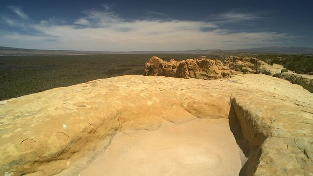 Sandstone Bluffs, El Malpais National Monument in the desert of New Mexico is a dramatic landscape made of Dakota Sandstone that contrasts with the dark lava flows farther below. North America