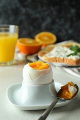 Concept of tasty breakfast with boiled egg, close up