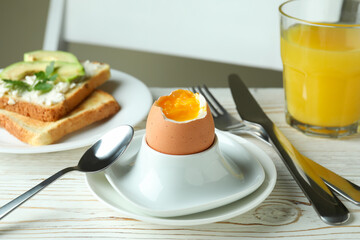 Concept of tasty breakfast with boiled egg, close up