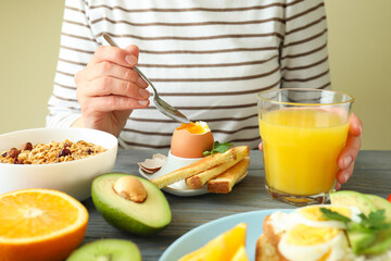 Concept of tasty breakfast on wooden table, close up